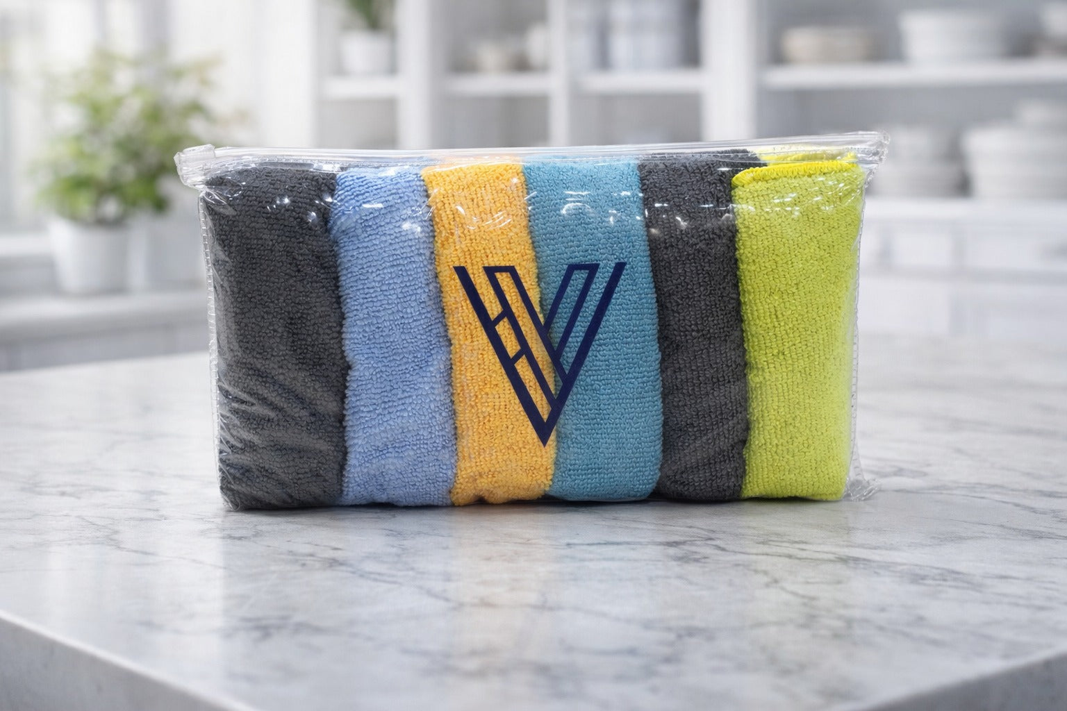 Packaged bundle row of multi-color Vorre basic microfiber cleaning cloths sitting on a counter.