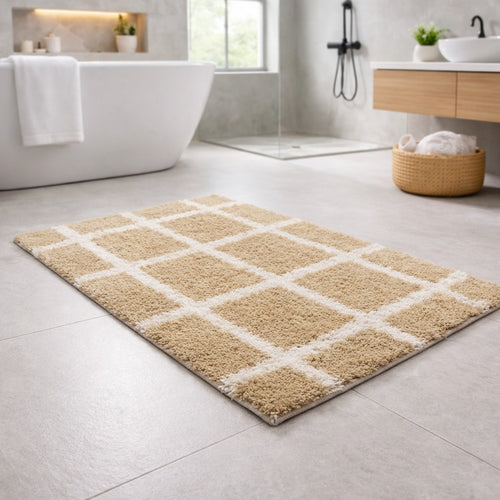 Beige checkered grid pattern recycled cotton bathmat by Vorre in a modern bathroom setting.