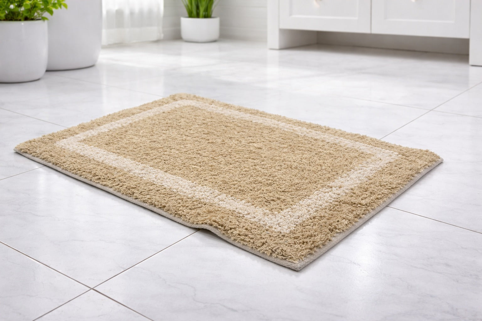 Beige tan 1400 GSM cotton mix bathmat featuring a classic rectangular border design.