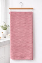 Dark  pink Vorre Blush microfiber bath towel, highly absorbent 70x140 cm body sheet hanging neatly.