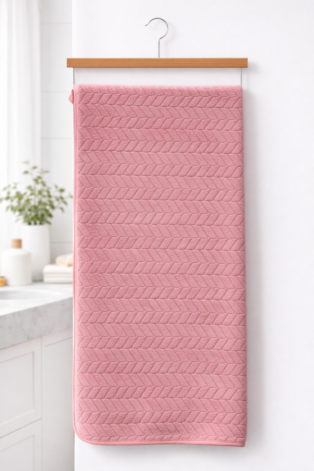Dark  pink Vorre Blush microfiber bath towel, highly absorbent 70x140 cm body sheet hanging neatly.