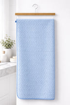 Sky blue textured Vorre Blush microfiber bath towel, multi-purpose compact utility towel for gym, spa, and travel.