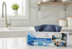 Charcoal grey Vorre reuse microfiber wipes box on a kitchen counter, lint-free cleaning cloths.