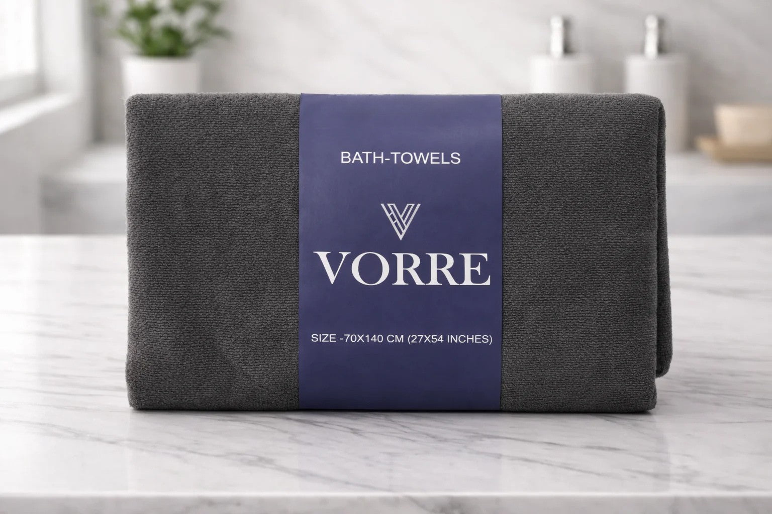 Packaged charcoal grey Vorre Classic microfiber bath towel wrapped with a premium navy blue product label band.