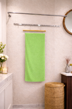 Vibrant lime green Vorre Classic microfiber bath towel, 400 GSM lint-free quick-dry towel wrapped with a luxury brand paper band.