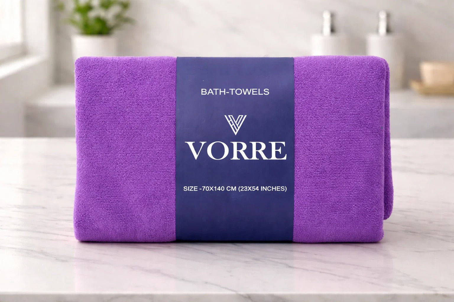 Packaged royal purple Vorre Classic microfiber bath towel neatly folded and wrapped with a dark blue luxury branded paper band.