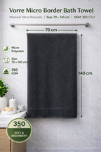 Size blueprint infographic for the charcoal grey Vorre Micro Border bath towel highlighting the 70x140 cm dimensions and balanced 350 GSM texture.