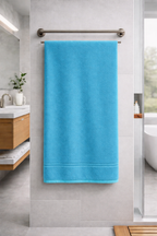 Vibrant turquoise cyan blue Vorre Micro Border bath towel, lightweight and plush micro polyester everyday towel.