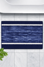 Navy blue ribbed ridge pattern micro polyester bathmat with protective rubber backing.