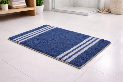 Navy blue Vorre recycled cotton bathmat with white stripes, highly absorbent 1400 GSM bathroom rug set.