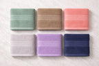 Six folded color choices of Vorre Norvelle premium 400 GSM eco-friendly hand towel bundles.