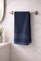 Navy blue Vorre Norvelle ultra-absorbent recycled cotton hand towel for gym, travel, and bath.