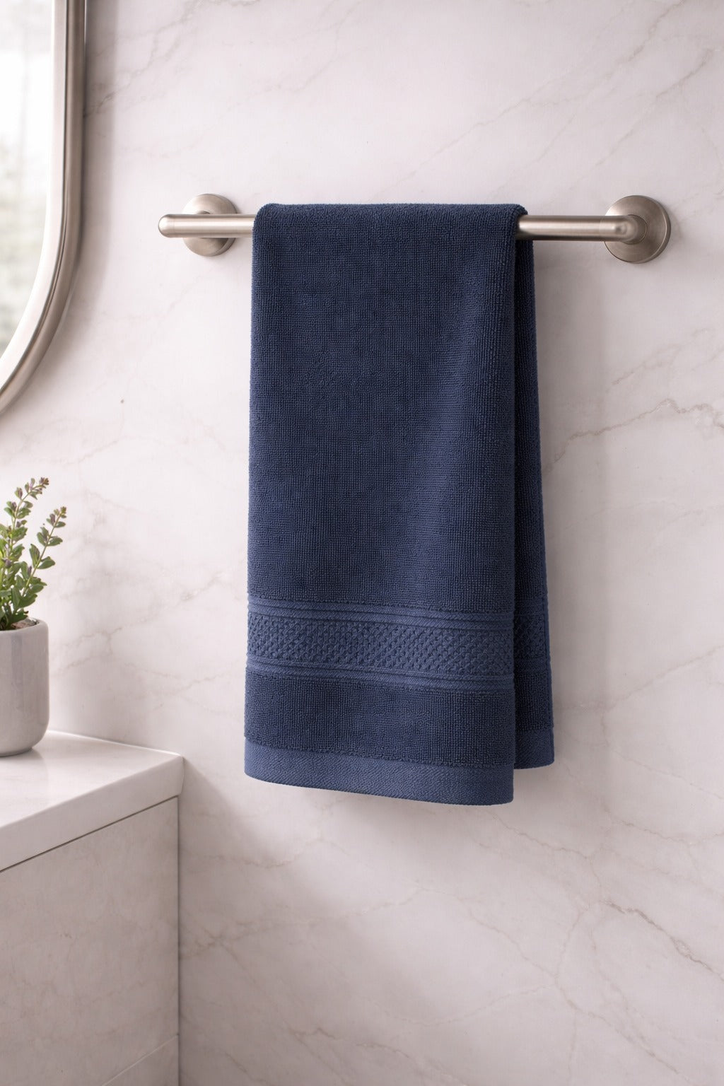 Navy blue Vorre Norvelle ultra-absorbent recycled cotton hand towel for gym, travel, and bath.
