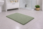 Olive green fluffy surface micro polyester bath mat with an anti-skid base for bathroom floors.