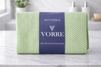 Packaged mint green geometric print Vorre microfiber bath towel featuring a dark blue luxury product label sleeve.