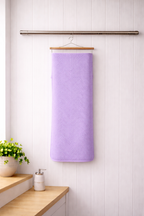 Lavender purple Vorre Pattern microfiber bath towel, 280 GSM quick-dry printed body towel hanging on a modern bathroom rod.