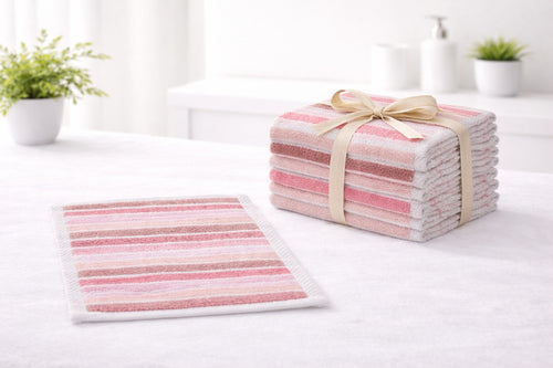 Vorre 550 GSM pink striped premium cotton hand towels stacked on a white bathroom counter, 12 pack.