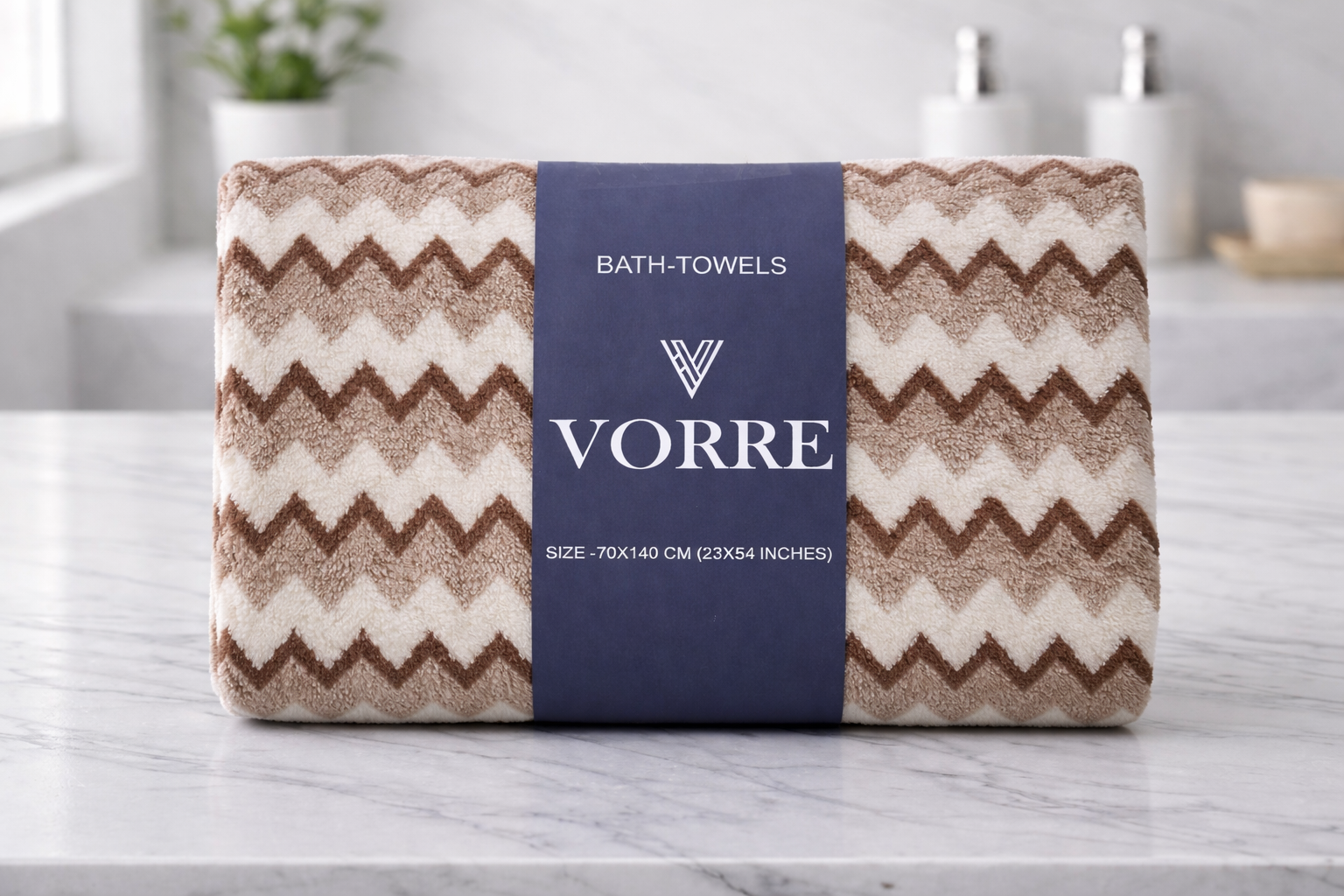 Packaged brown chevron wave pattern Vorre microfiber bath towel wrapped securely in a premium branded belly band.