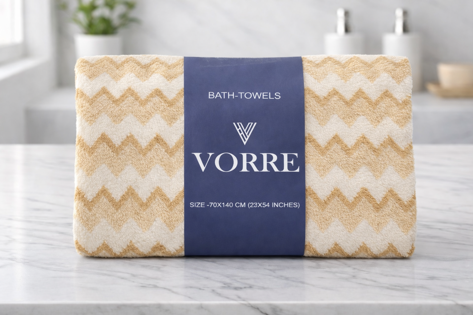 Packaged cream gold zig-zag Vorre microfiber bath towel featuring a dark blue signature brand sleeve wrapper.