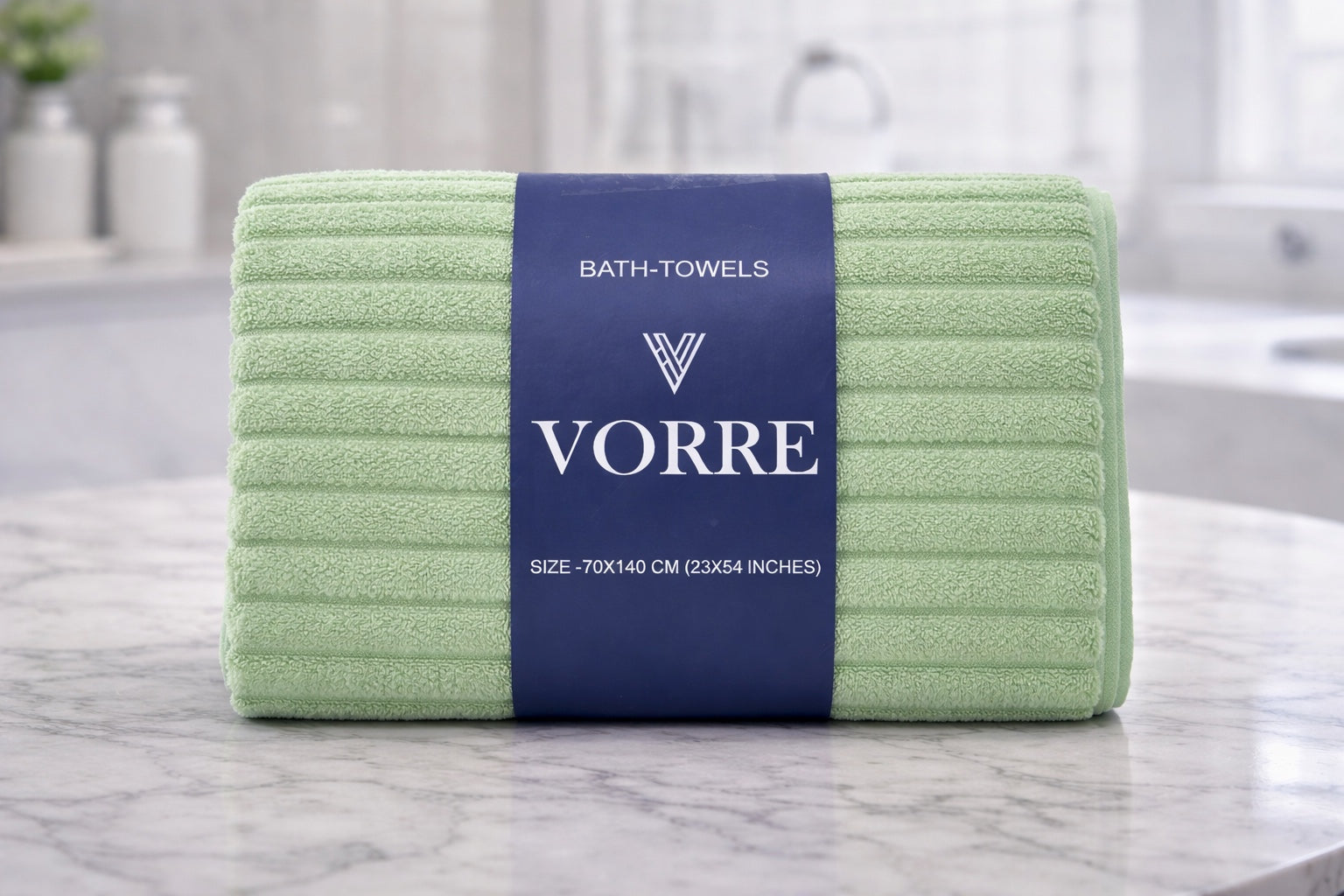 Muted mint green Vorre Ripped microfiber bath towel, lightweight absorbent 70x140 cm ribbed towel displayed in a bathroom.