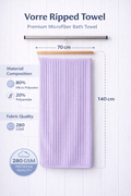 Lavender purple Vorre Ripped microfiber bath towel, 280 GSM quick-dry ribbed body towel hanging on a modern bathroom rod.