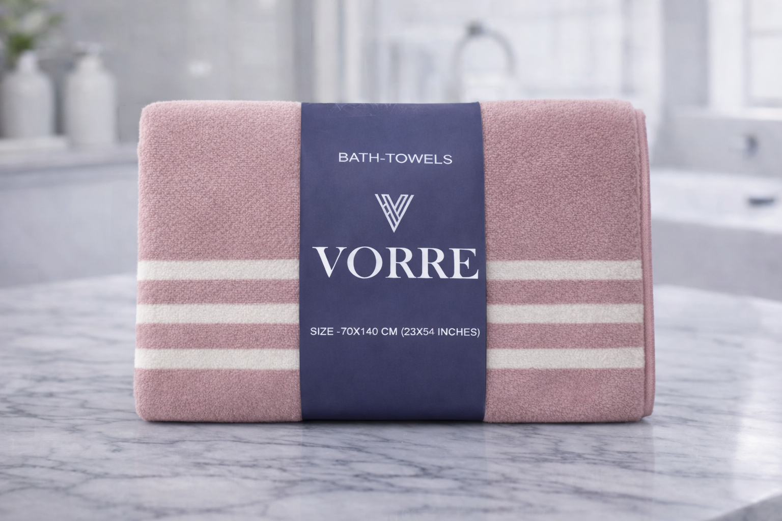 Packaged dusty rose pink striped Vorre microfiber bath towel with a signature dark blue luxury paper wrapper.