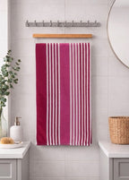 Crimson maroon, pink, and white vertical striped Vorre TNT micro polyester bath towel, lightweight 190 GSM travel and gym towel.
